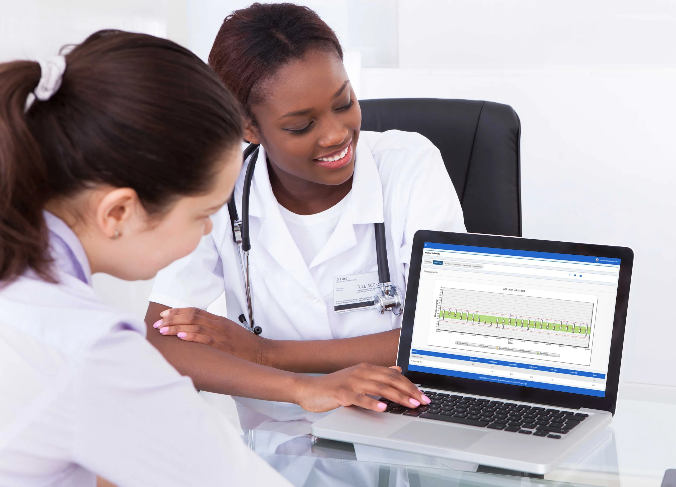 two women looking at laptop